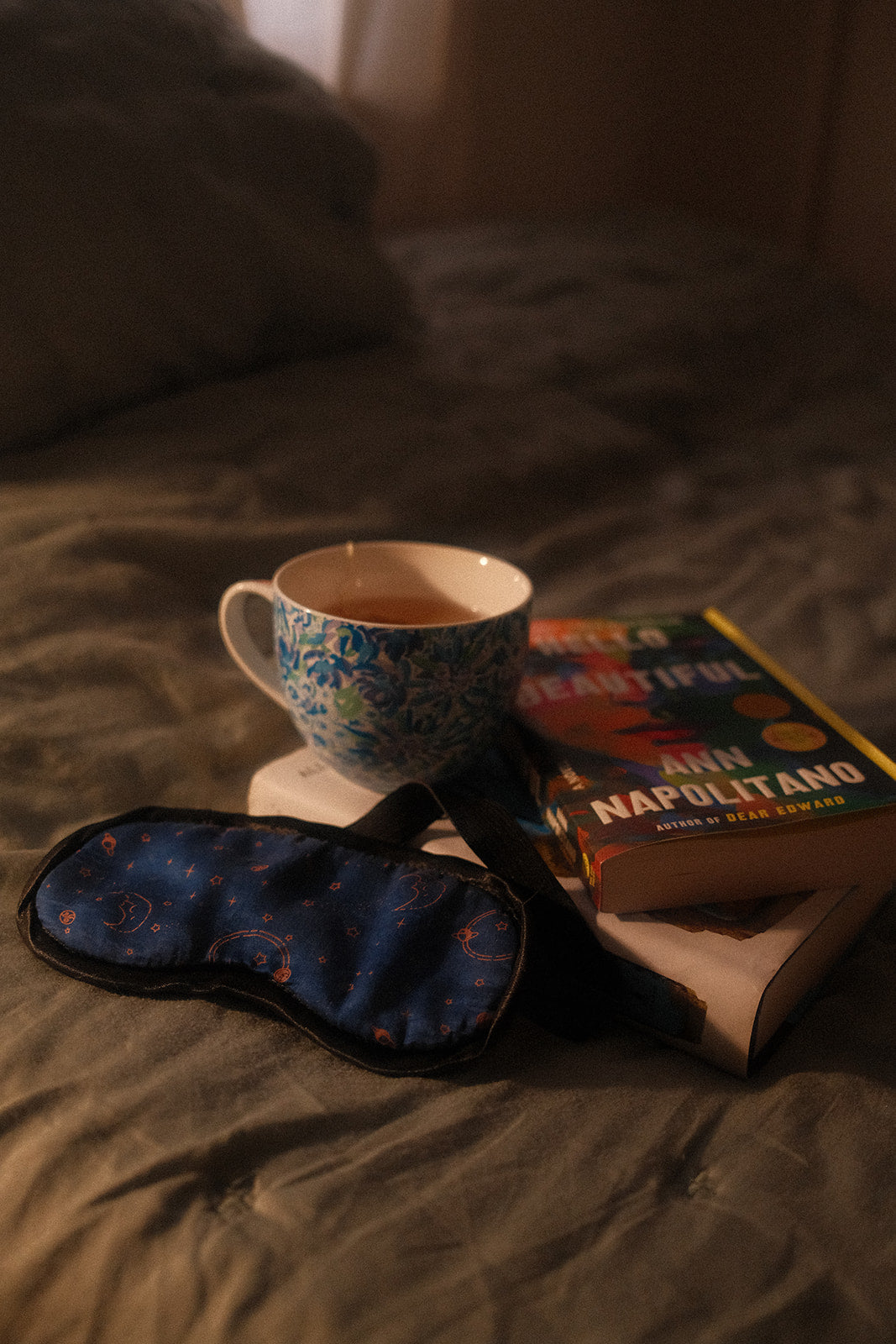 Doze Tea herbal tea bag with sleep mask and book for a nighttime relaxation routine