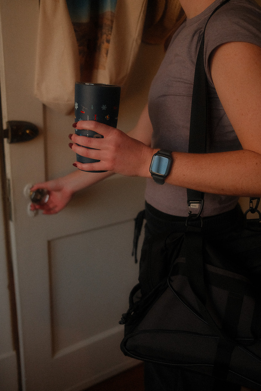 Person holding Doze Tea on-the-go mug for an active lifestyle
